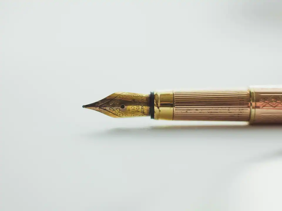 A fountain pen on white paper