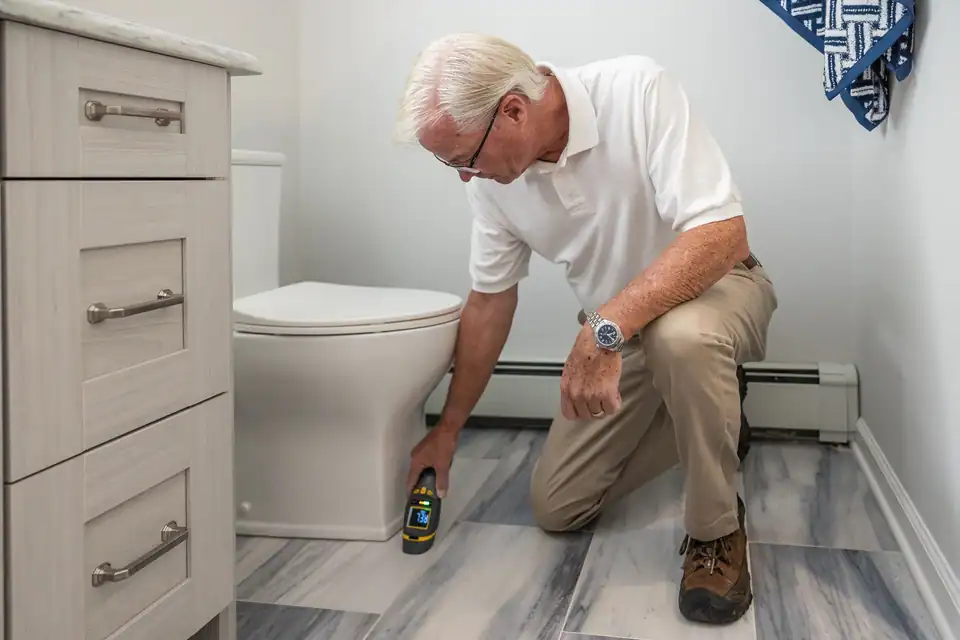 Mike Hartley at work in a customer's bathroom
